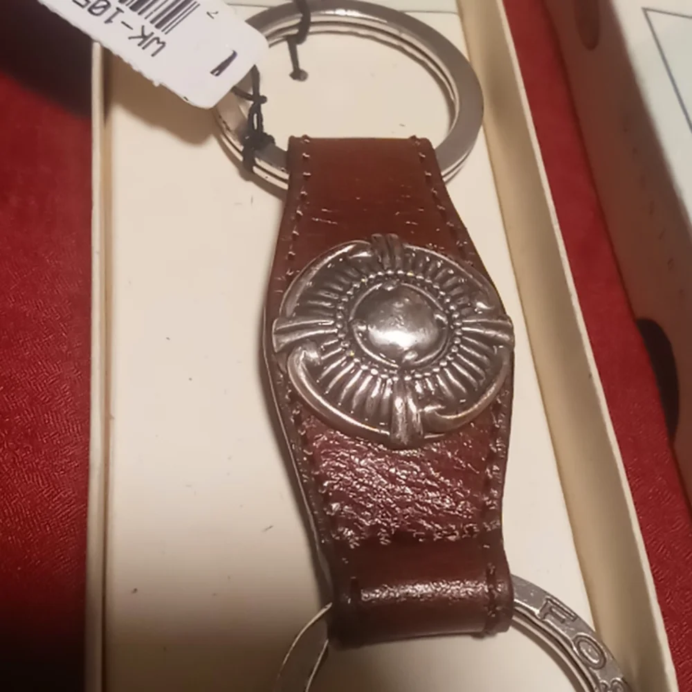 Fossil genuine leather snap key chain.